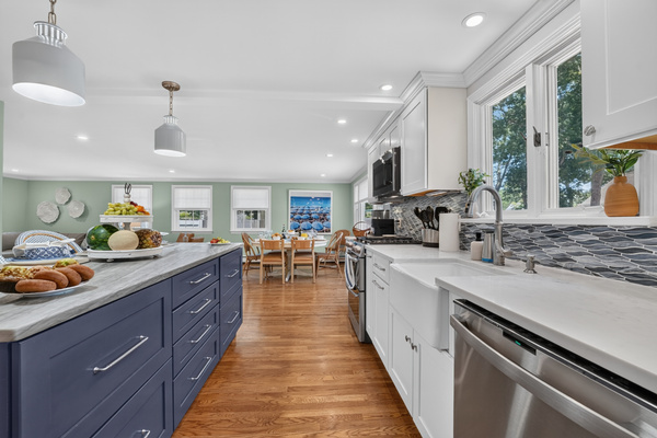 Fully equipped chef's kitchen with generous prep space and island seating.