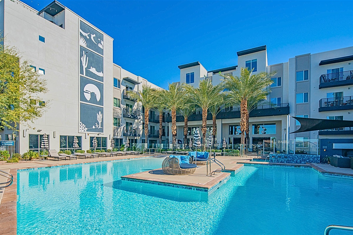 Luxurious poolside oasis with stunning desert-inspired art.