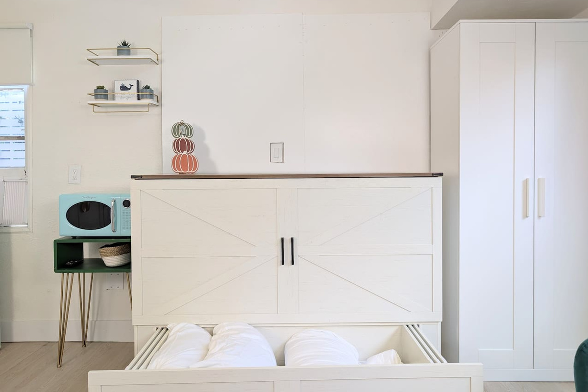 Space-saving Murphy bed with storage.