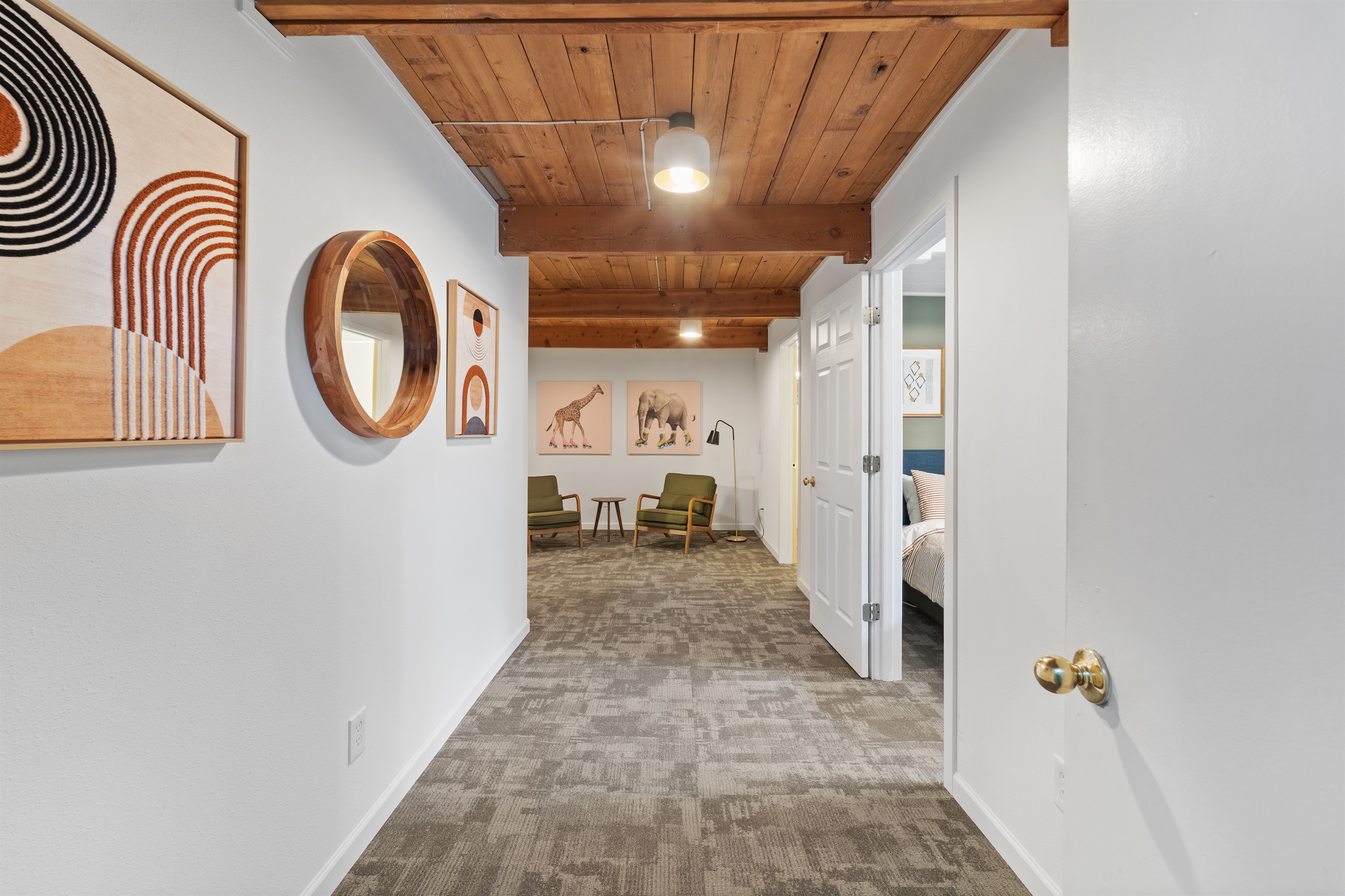 Lower level: hall to sitting area, bedroom & dedicated office/work space. 