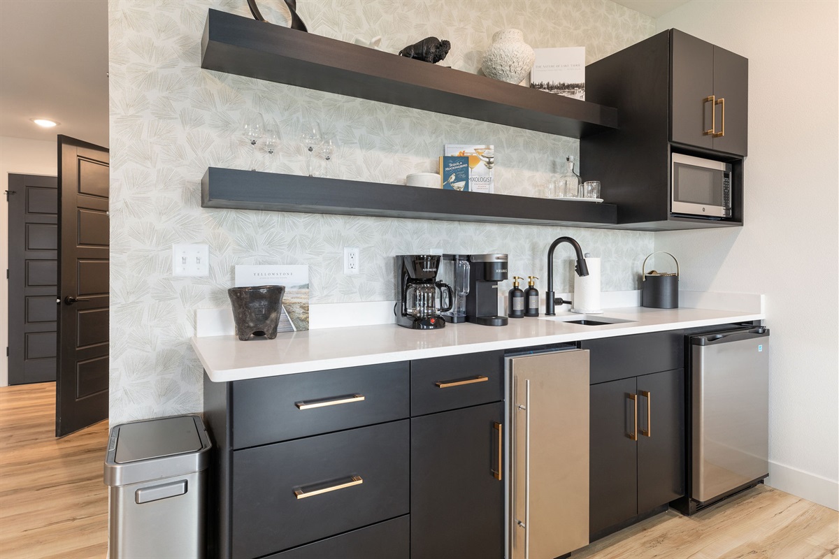 Lower level wet bar with mini fridge and ice machine