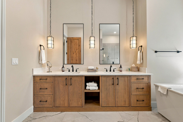 Spa-like primary bath with soaking tub, walk-in shower and double vanity