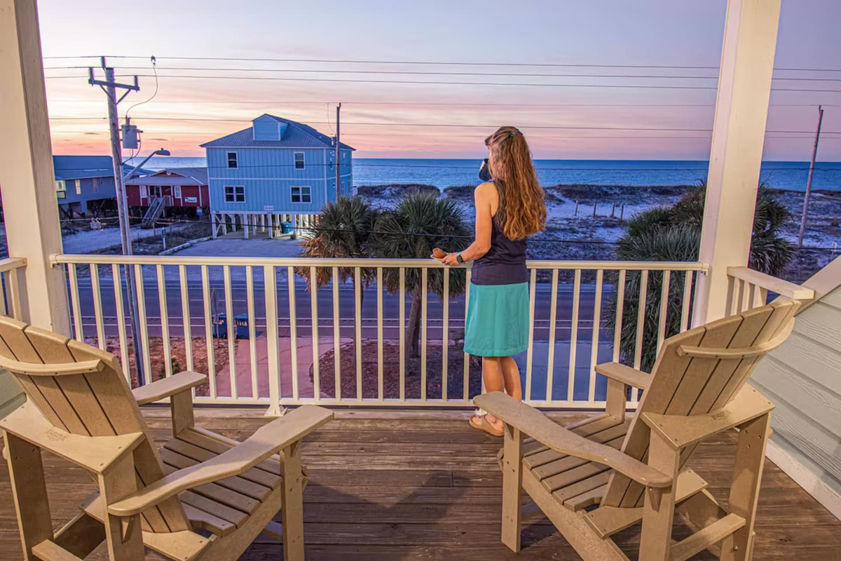 One of only four houses in Gulf Shores with direct views and access to the beach directly across the street.
