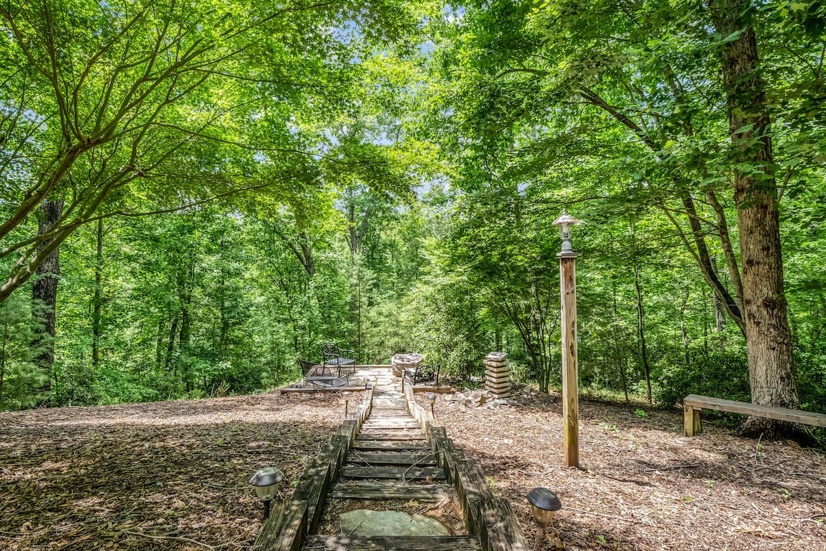 Follow the forest path to the fire pit and outdoor gathering space