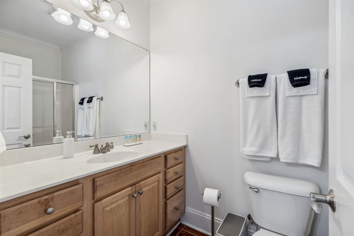 This bathroom is located on the ground level, attached to the living room 2/bedroom 4