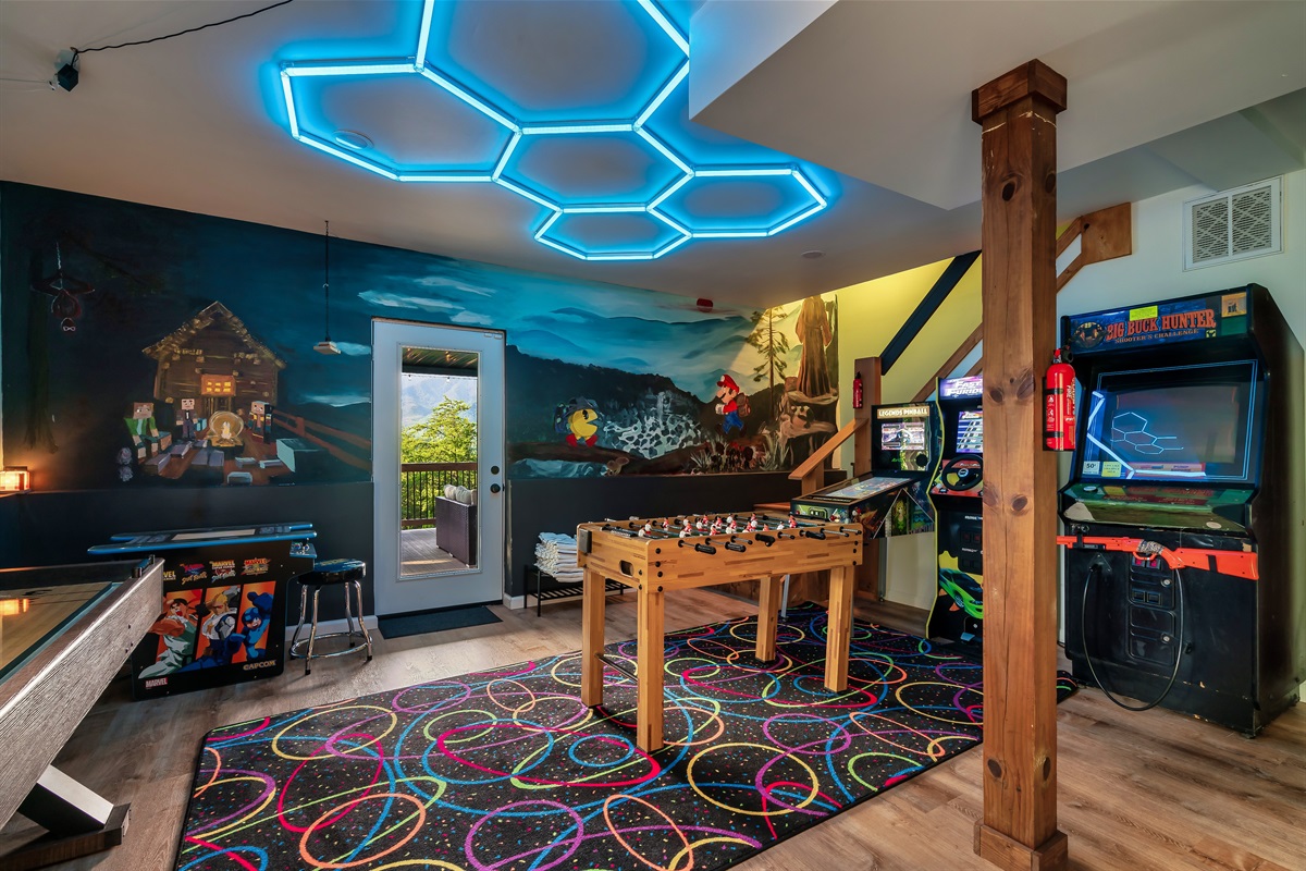Game room has 4 arcade games, foosball, and shuffleboard