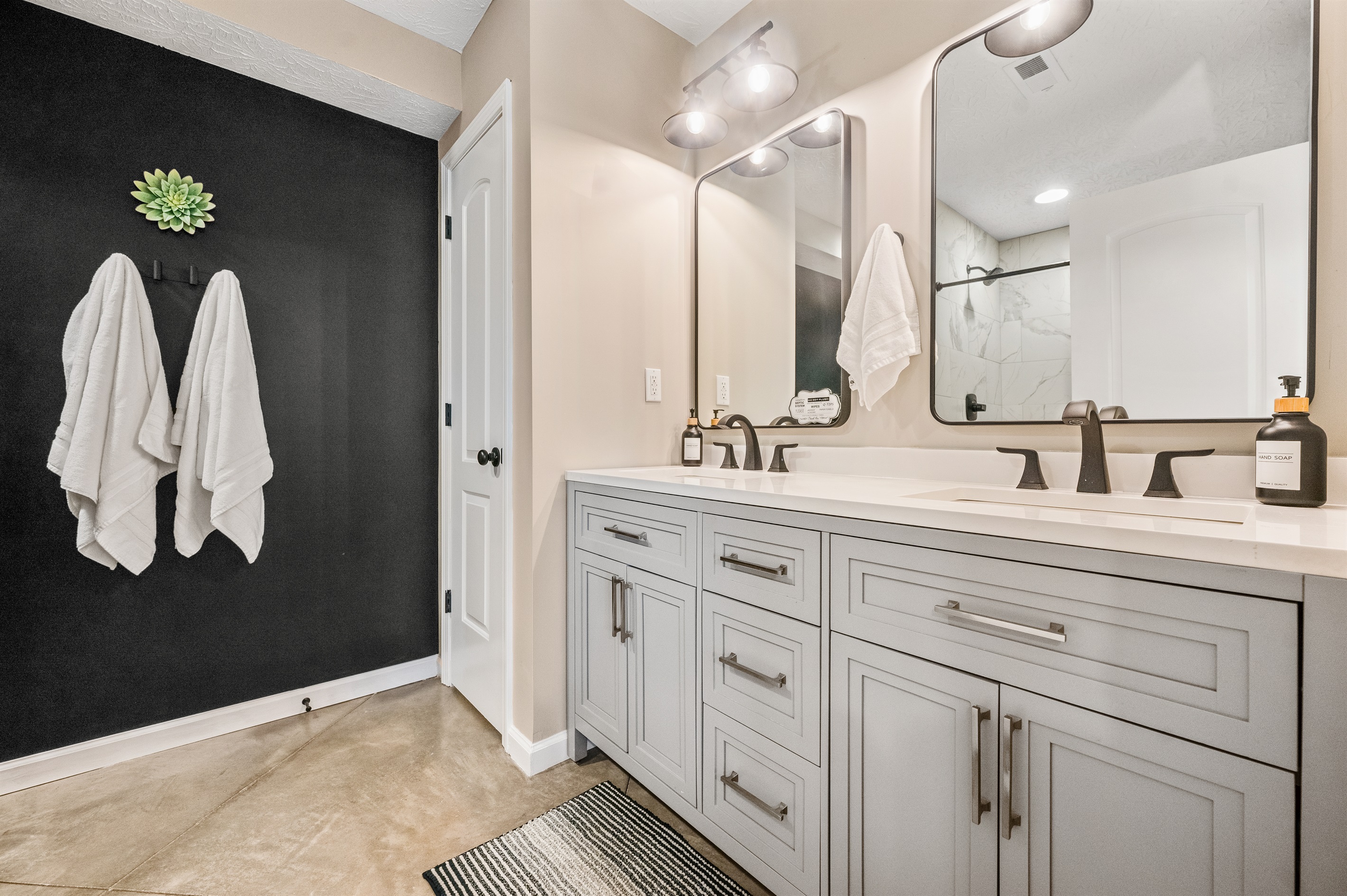 Designed for convenience, the double vanity offers dual sinks, large mirrors, and plenty of space to spread out.