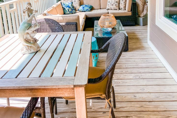 Upper deck has lounge area and table for 4