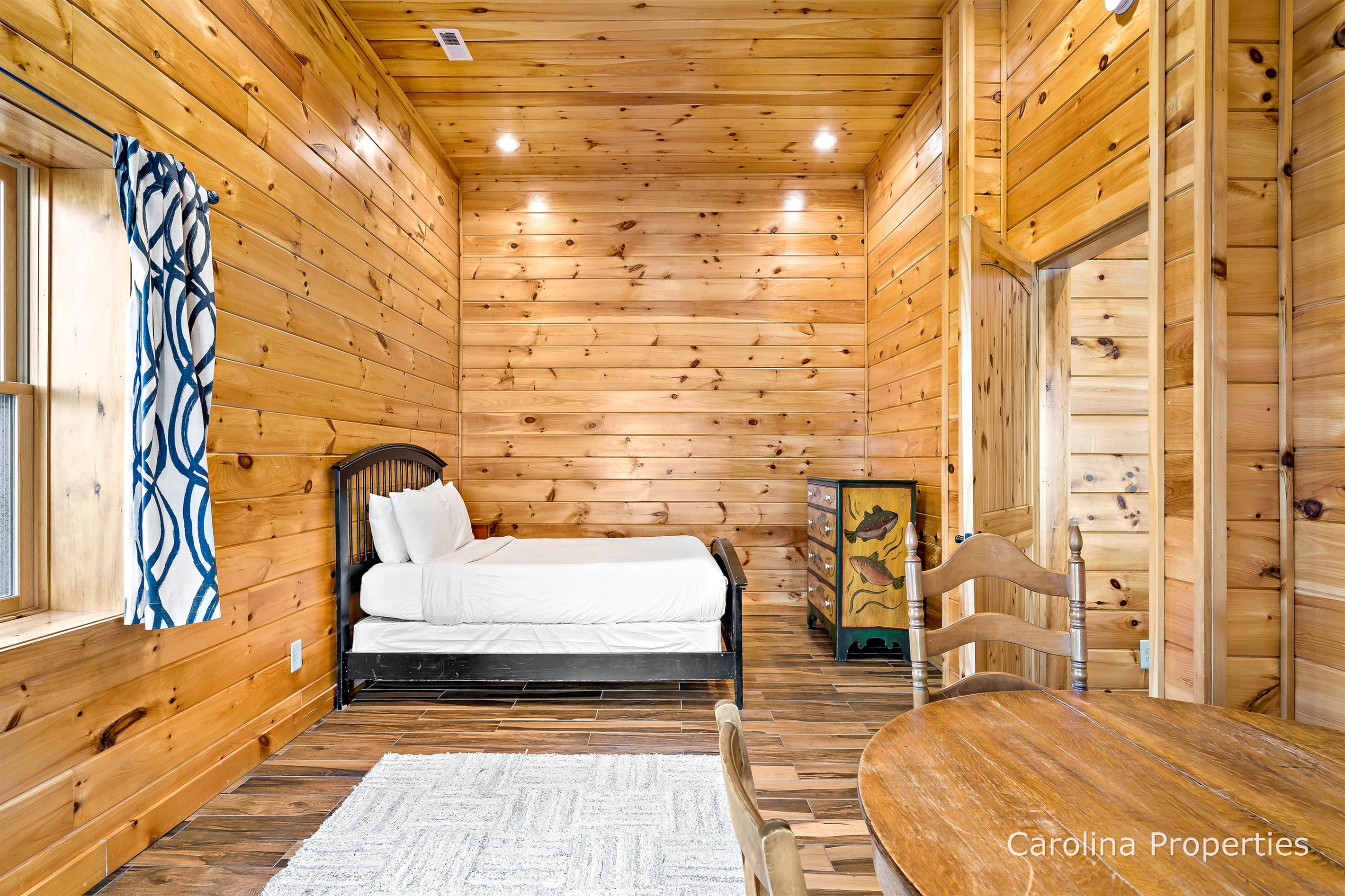 Lower level bedroom with queen bed
