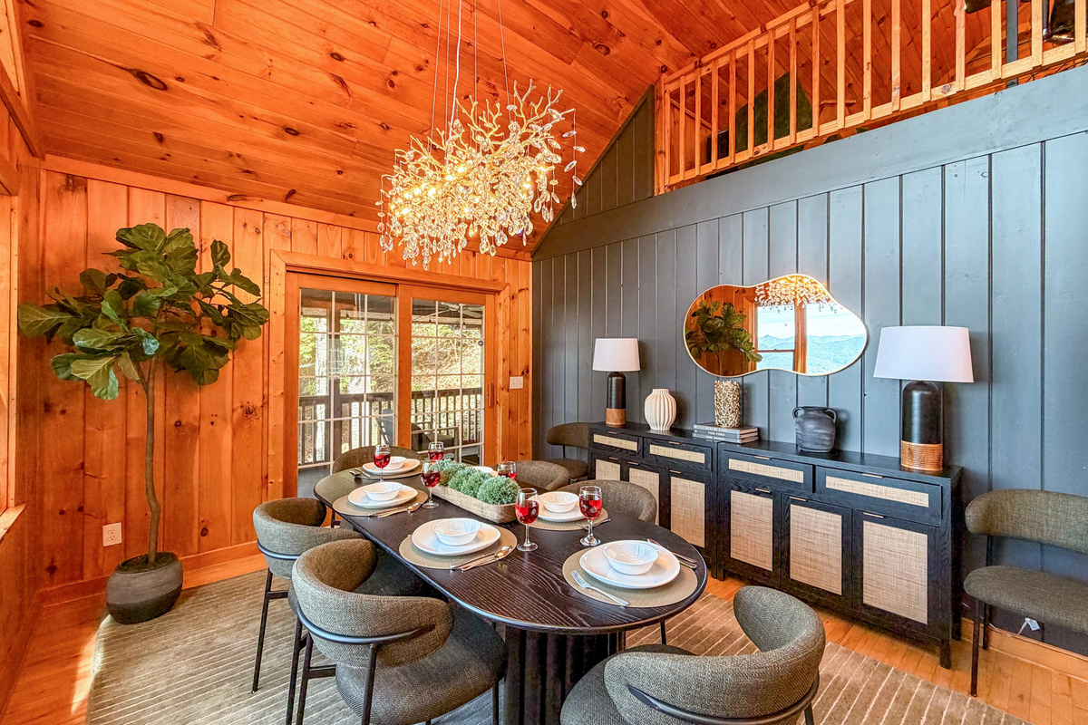Our dining area features elegant rustic decor and comfortably seats up to six guests, perfect for enjoying meals with a view.