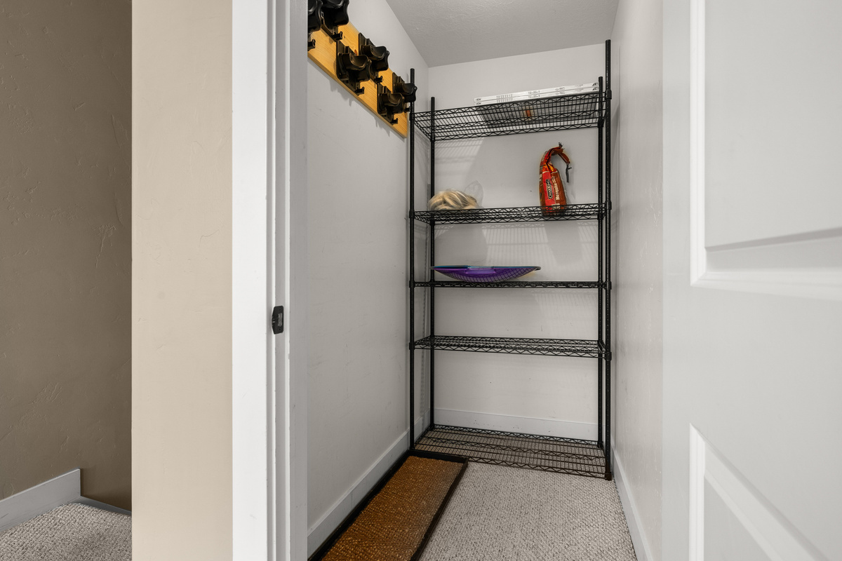 A convenient entry ski locker closet gives you space to drop gear and transition comfortably into the home.
