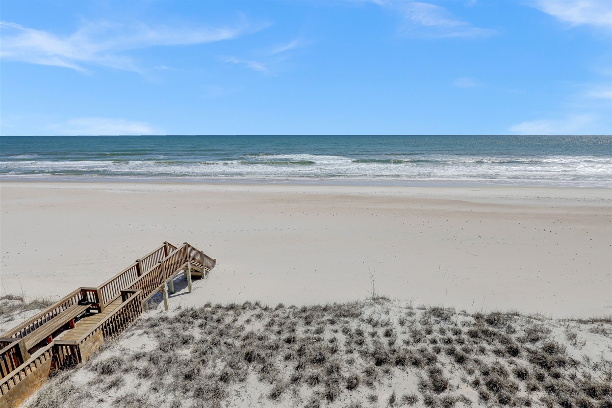 Uninterrupted views of the dunes and waves from your private boardwalk access.