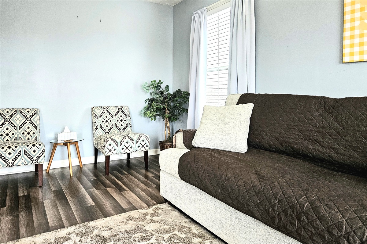 Spacious living room with elegant features and comfortable seating. High Speed WIFI, smart TV and keyless entry included.