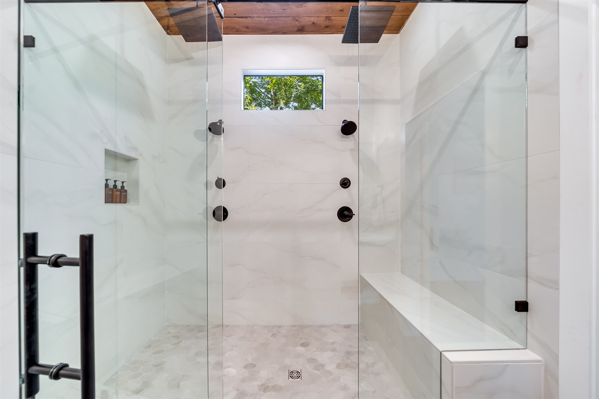 Ensuite Bathroom 3 - Attached to King Suite 3. Featuring enormous rain shower with quad showerheads, and spa-quality marble finishes. Includes premium toiletries (body wash, shampoo, conditioner, hand soap) and hotel quality towels. 