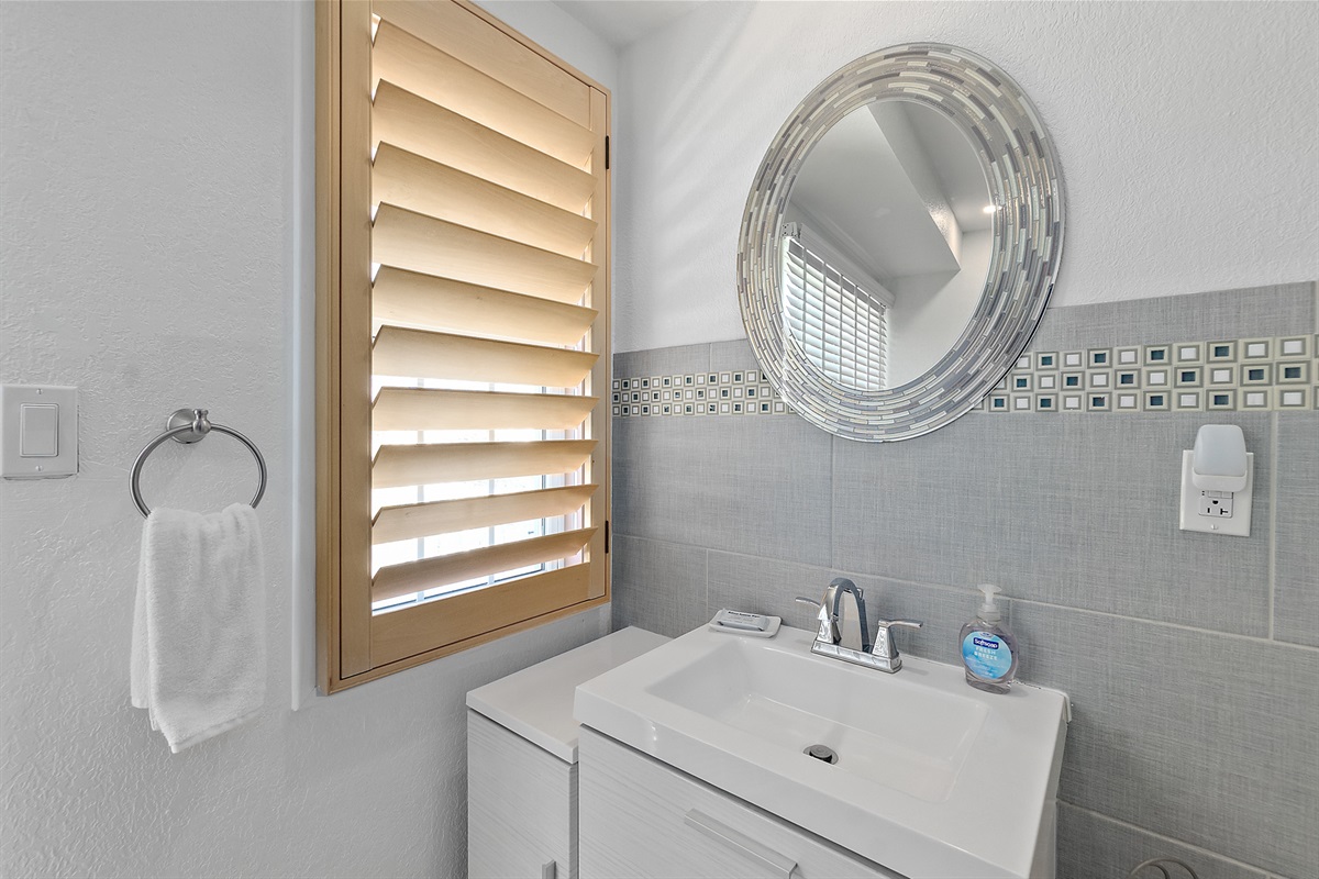 Bright guest bath with beachy details