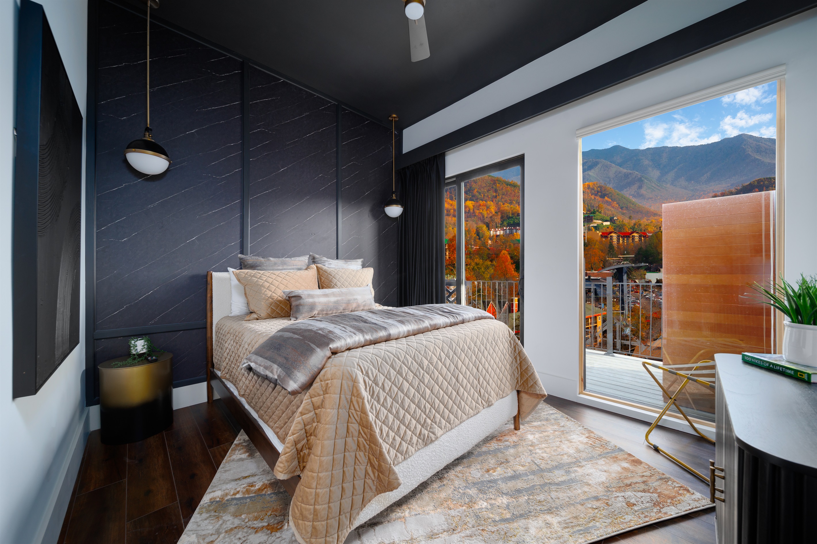 A luxurious Queen bedroom with beautiful mountain view, designed for ultimate relaxation and comfort.
