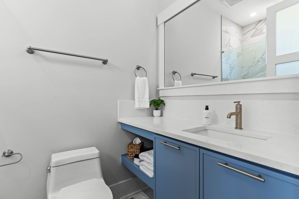 Thoughtful touches make every stay easier. This private en-suite bathroom comes stocked with essentials like hand soap, makeup cloths, tissues, and more.