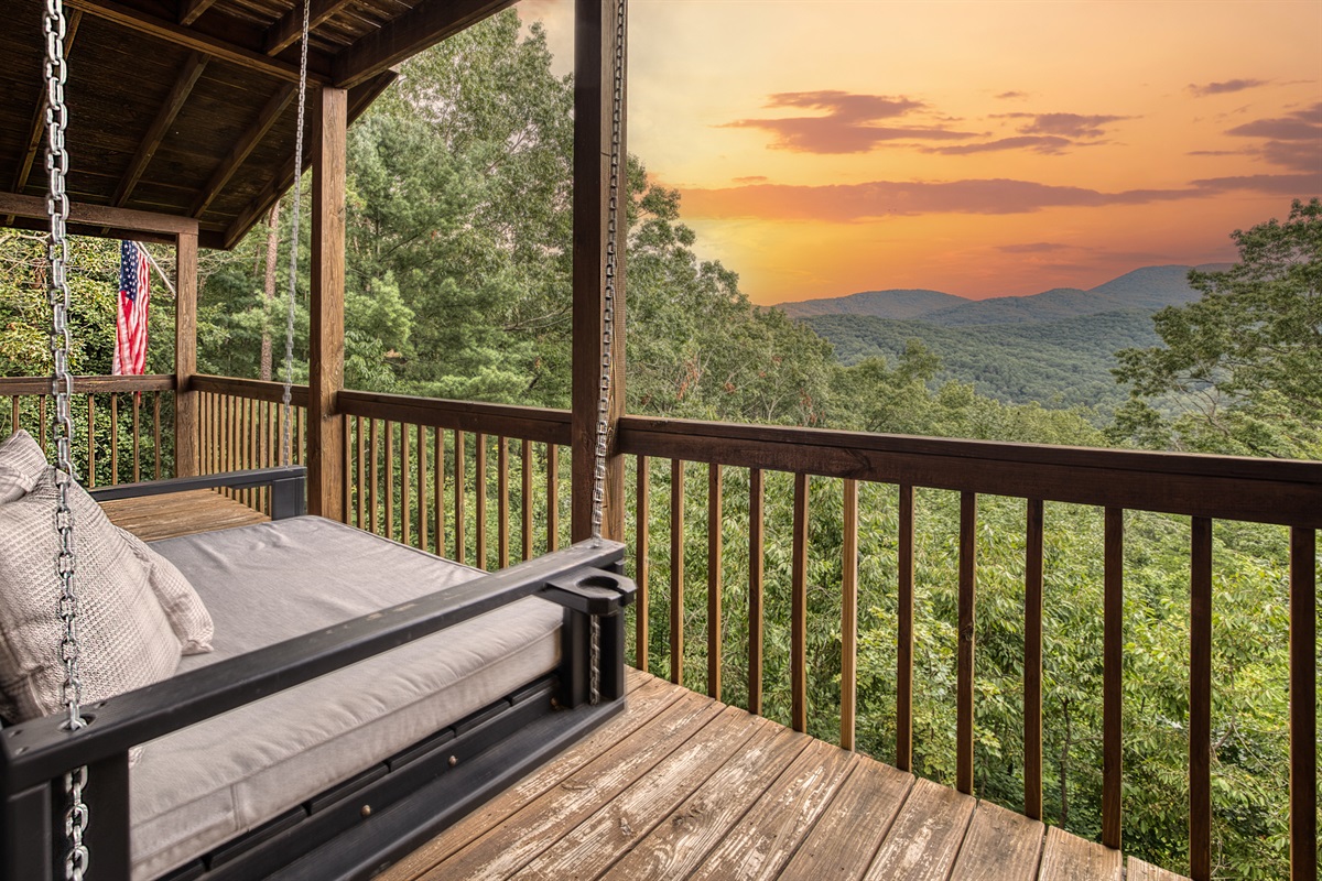 Cuddle up with a good book or your favorite beverage on the bed/swing located on the 1st floor wrap around porch.