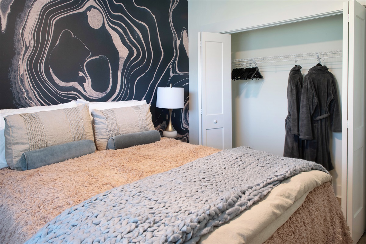 Guest Bedroom #2 with queen bed and bold accent wall