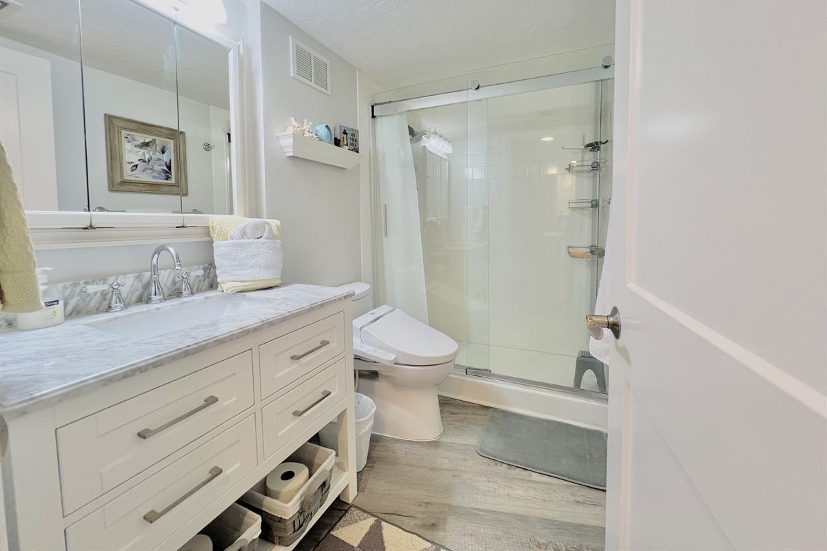 Fresh, spa-style bathroom with modern finishes and a walk-in shower.