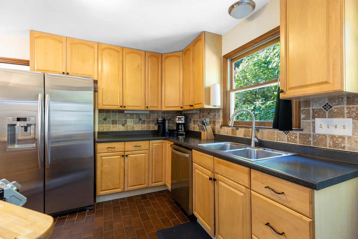 Inside the kitchen, there are both a coffee maker and a Keurig.