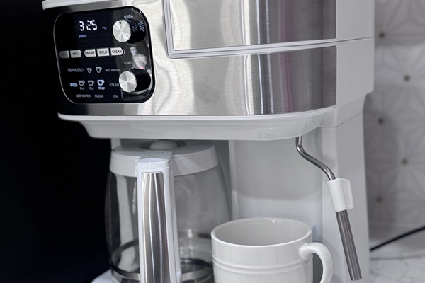 4-1 coffee maker; makes drip coffee, either single K-cup or whole pot, espresso, and milk frother wand. (Coffee set up featured)