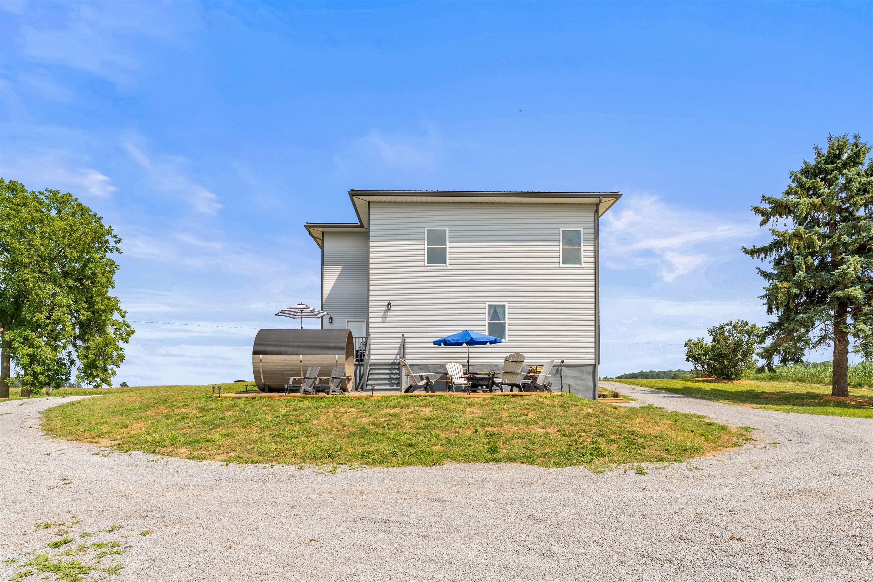Perfect for gatherings—enjoy firepit evenings, shaded seating, and endless views in a private country retreat.
