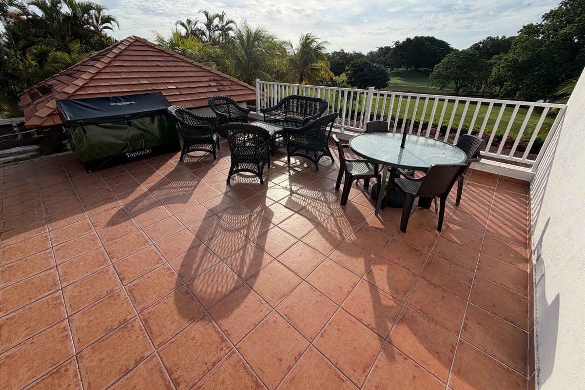 2nd floor patio outside primary bedroom (cushions & umbrella inside storage locker