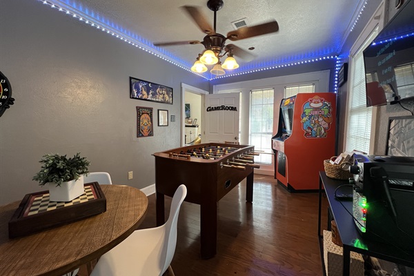 The game room features an 80s-style arcade game, foosball, darts, karaoke, tons of board games, and a DVD player.  