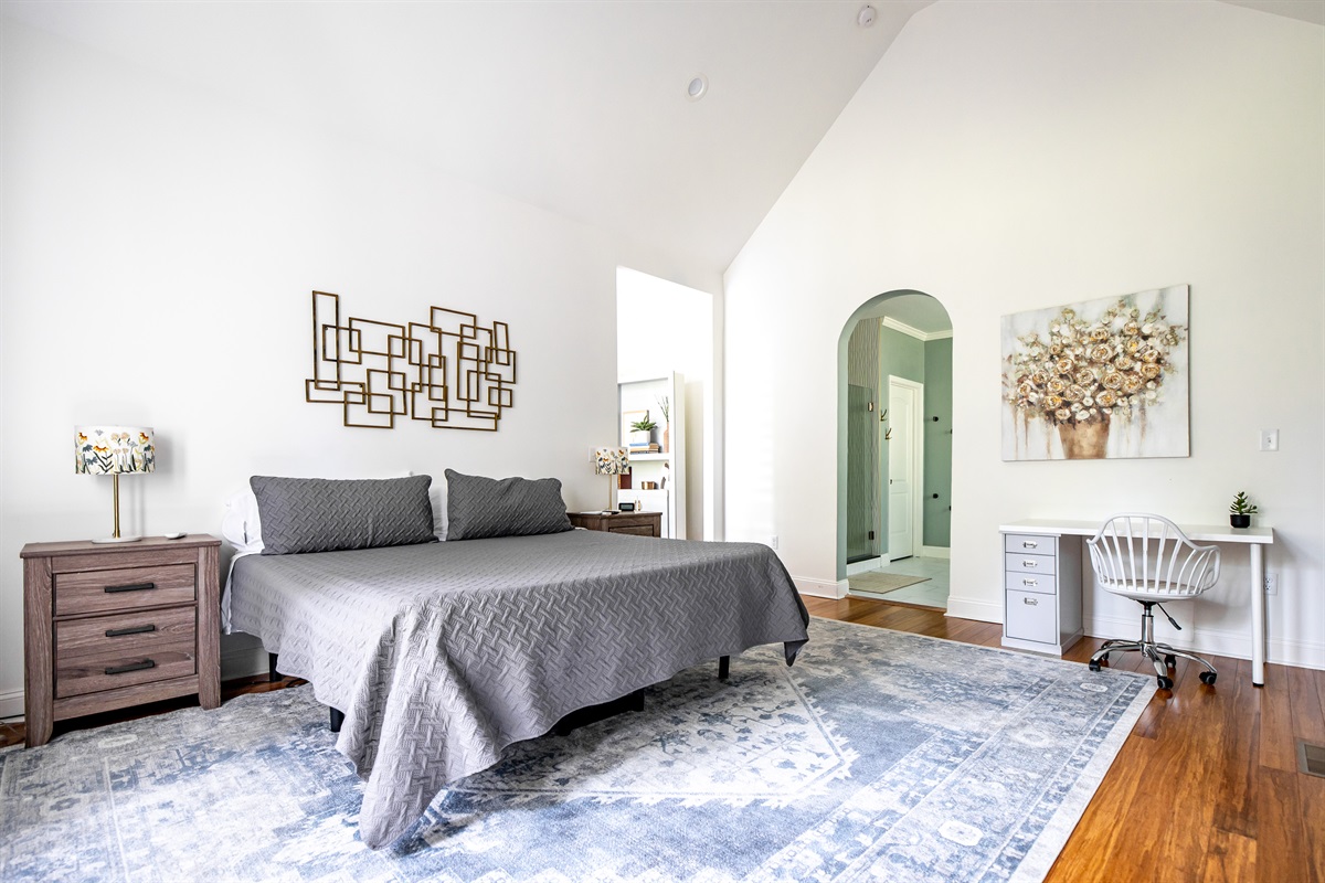 Main bedroom with king bed,  TV, desk