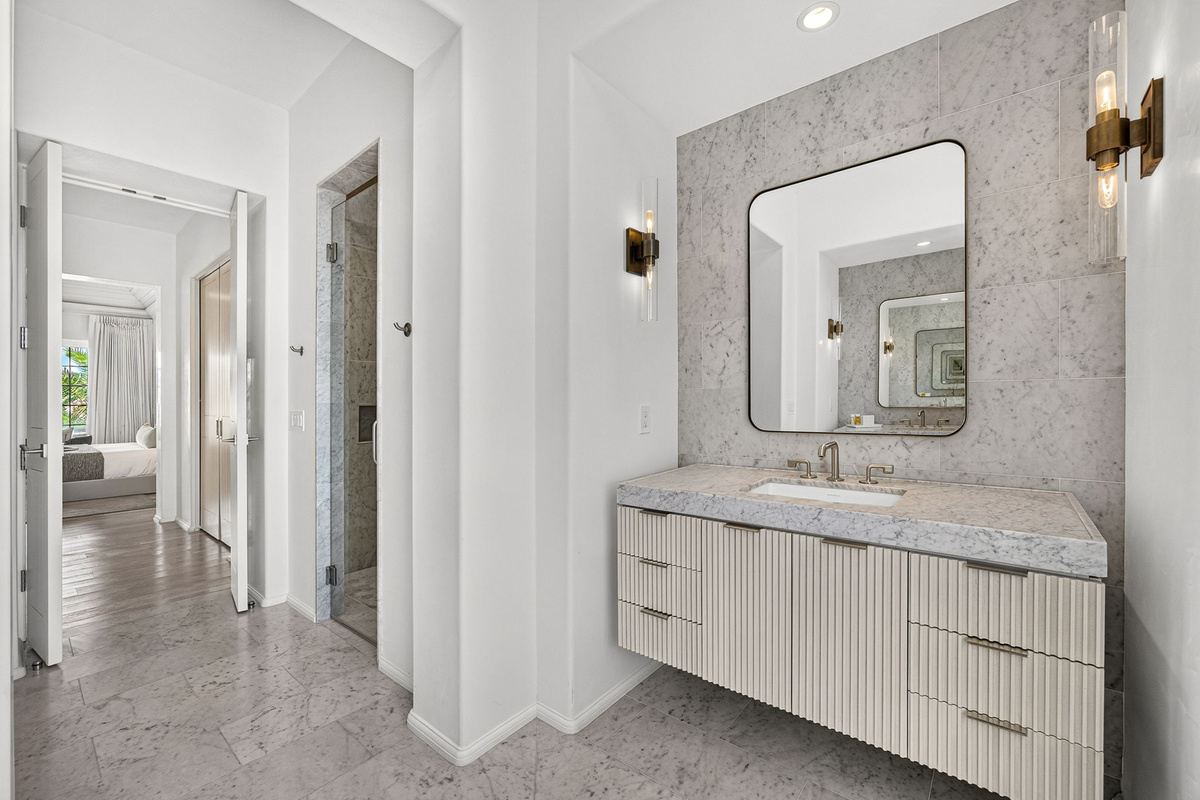 The Primary suite offers two oversized vanities.