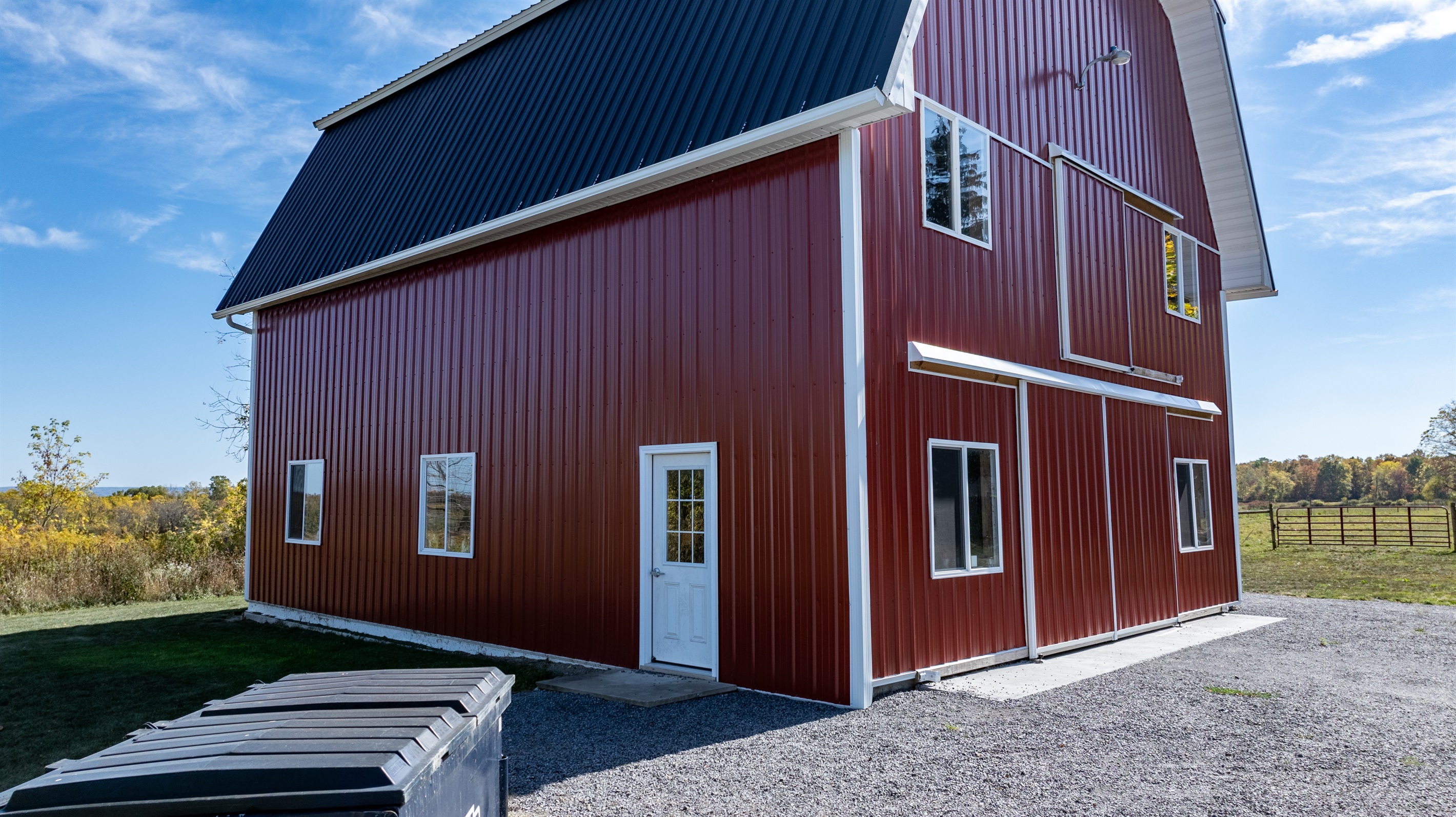 Close-up of the red barn exterior — freshly restored and full of rustic charm