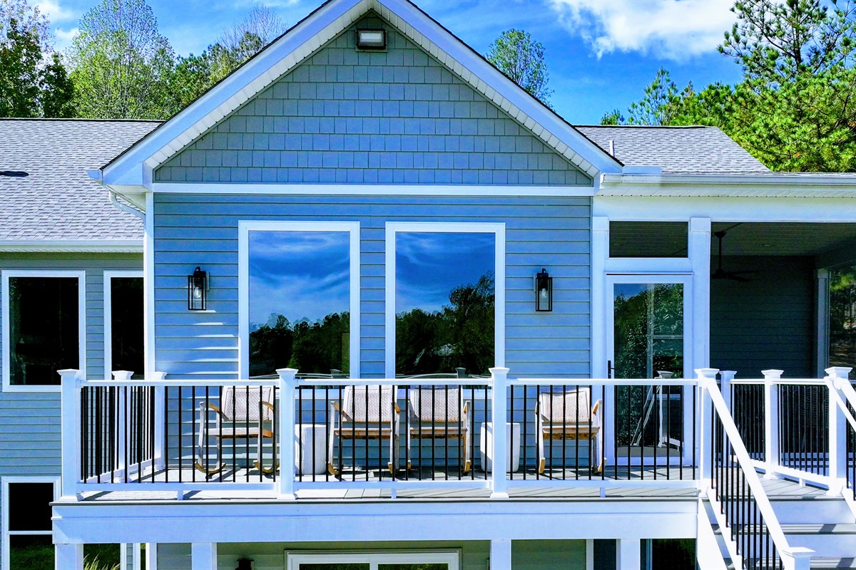 Relax on this spacious deck with stunning lake views! Sip your morning coffee, enjoy the fresh air, and watch the sunset over the water. The perfect spot for unwinding and taking in the beauty of nature.