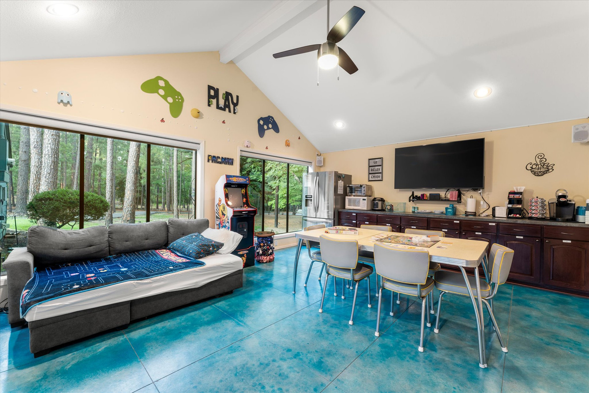 Bonus Room offers a pull-out couch bed with linens and pillows for a small teen or child. Features include a dining table for 6, full-size fridge, Keurig, microwave, toaster oven, dishes, silverware, Nintendo Switch with games, Pac-Man arcade and More!