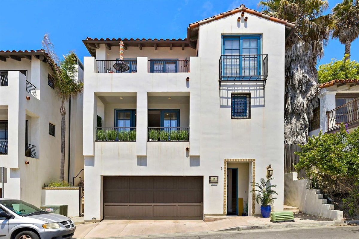 Exterior of the building.  This condo is the lower floor.  Parking for one car inside the garage.  There is also free overnight parking on Coronado Ln if you have a second car.