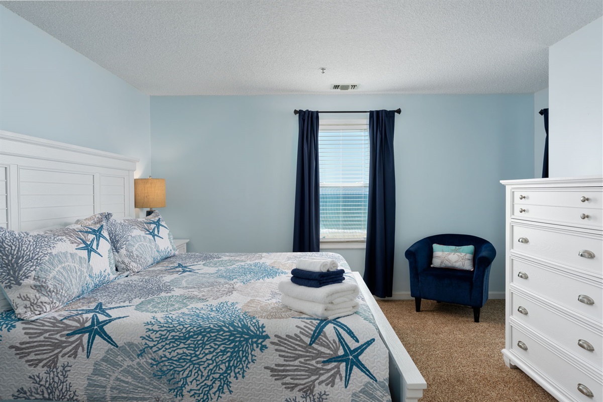 Bedroom 2 includes nightstands and a dresser