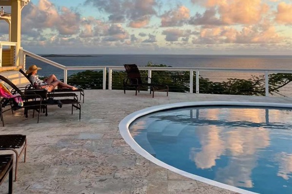 Enjoy the pool deck while watching the sun set over the horizon