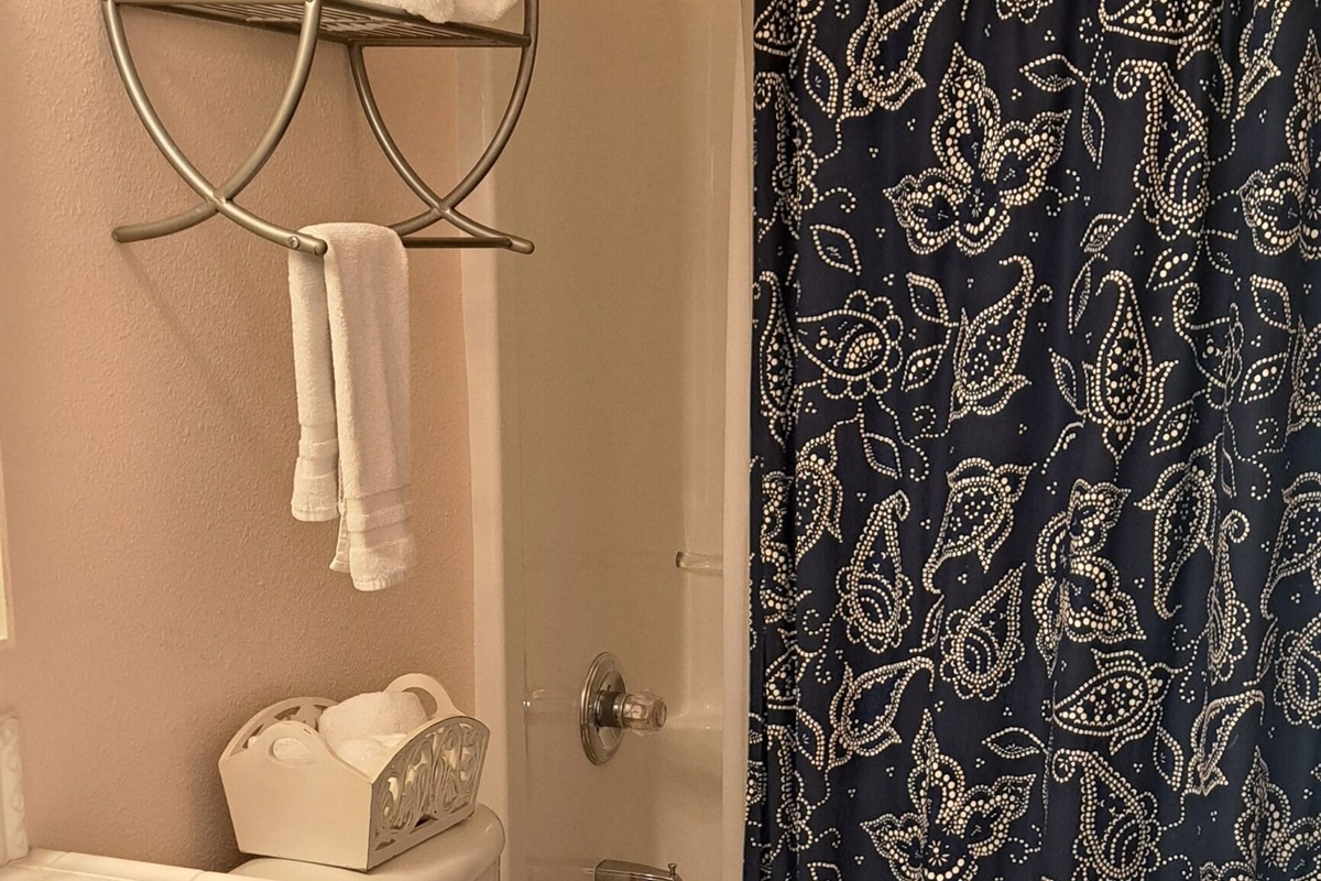 Enjoy easy access to a shared bath, designed for comfort and convenience.