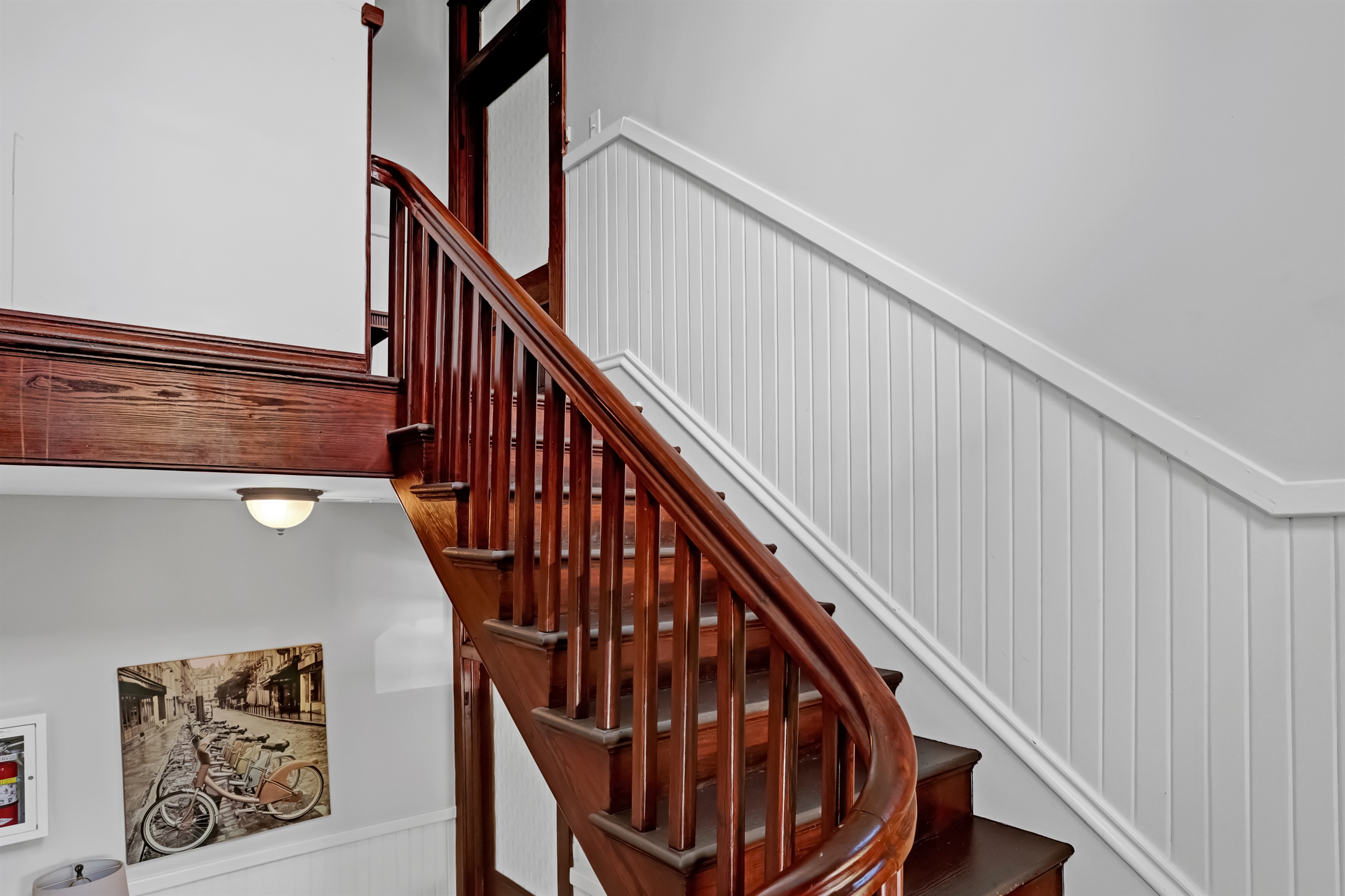 Tucked on the third floor, this elegant flat is worth the climb for charm, light, and historic views.