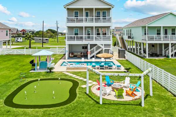 Everything You Need in One Place
From the pool and spa to the gazebo, putting green, fire pit, and outdoor entertainment areas, this drone view highlights the expansive backyard designed for relaxation and fun.