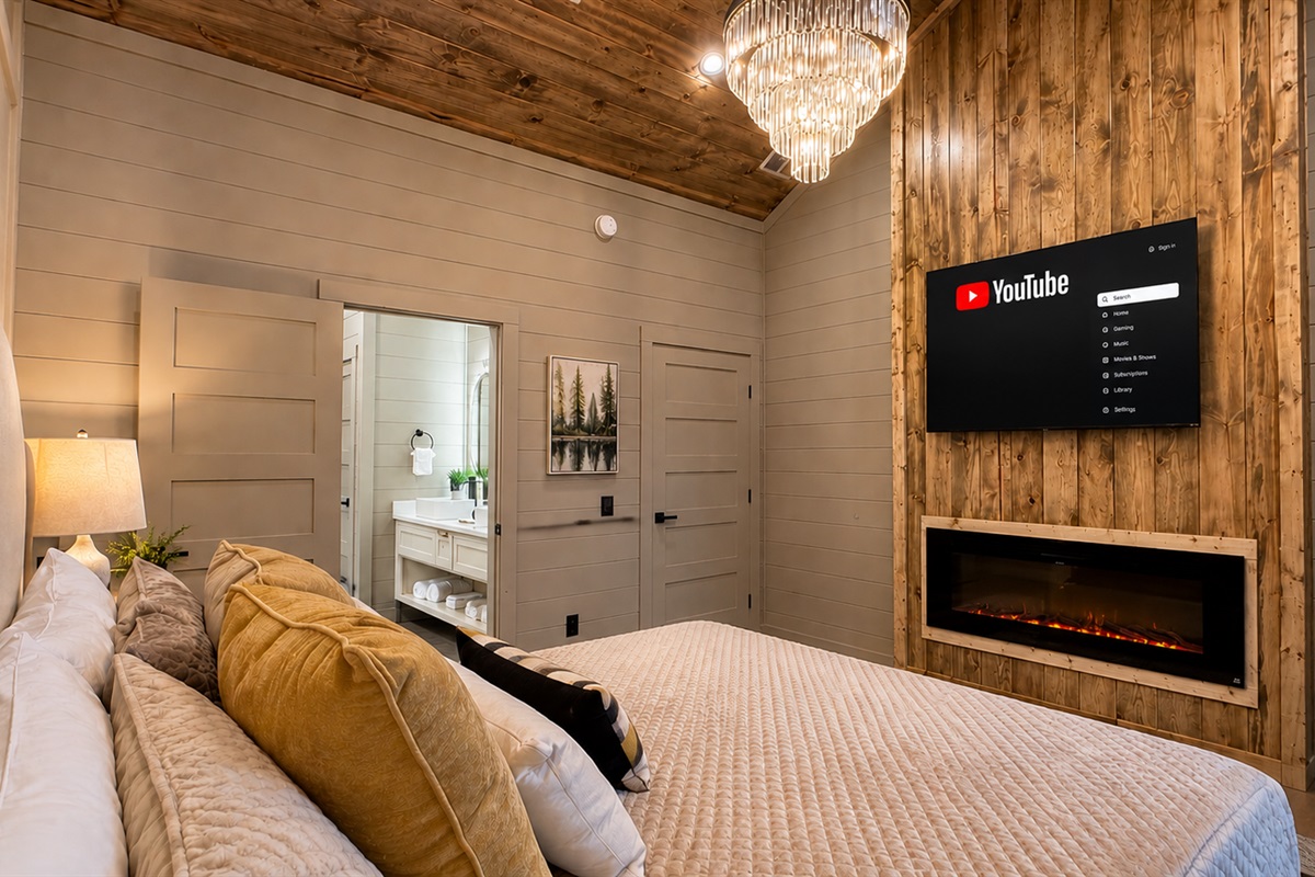 Master Bedroom: Elegant retreat with a sleek design, fireplace, and views for restful moments!