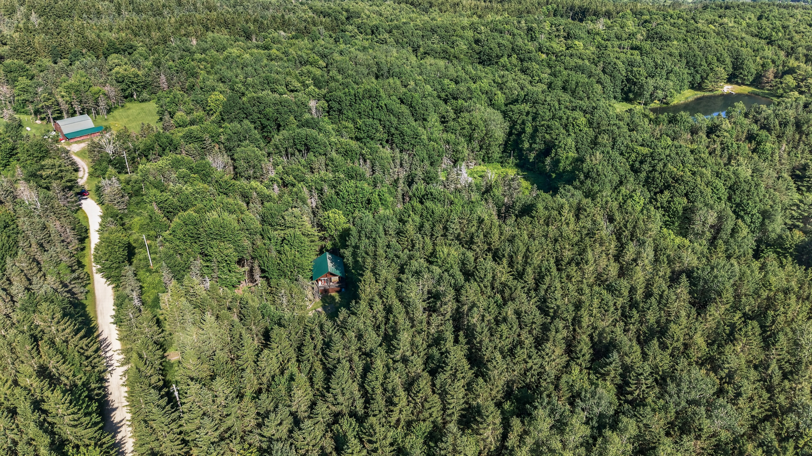 Aerial view of the property and driveway
