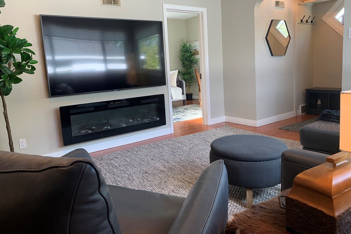 Bright Main Living Room with 75″ Smart TV & Cozy Fireplace