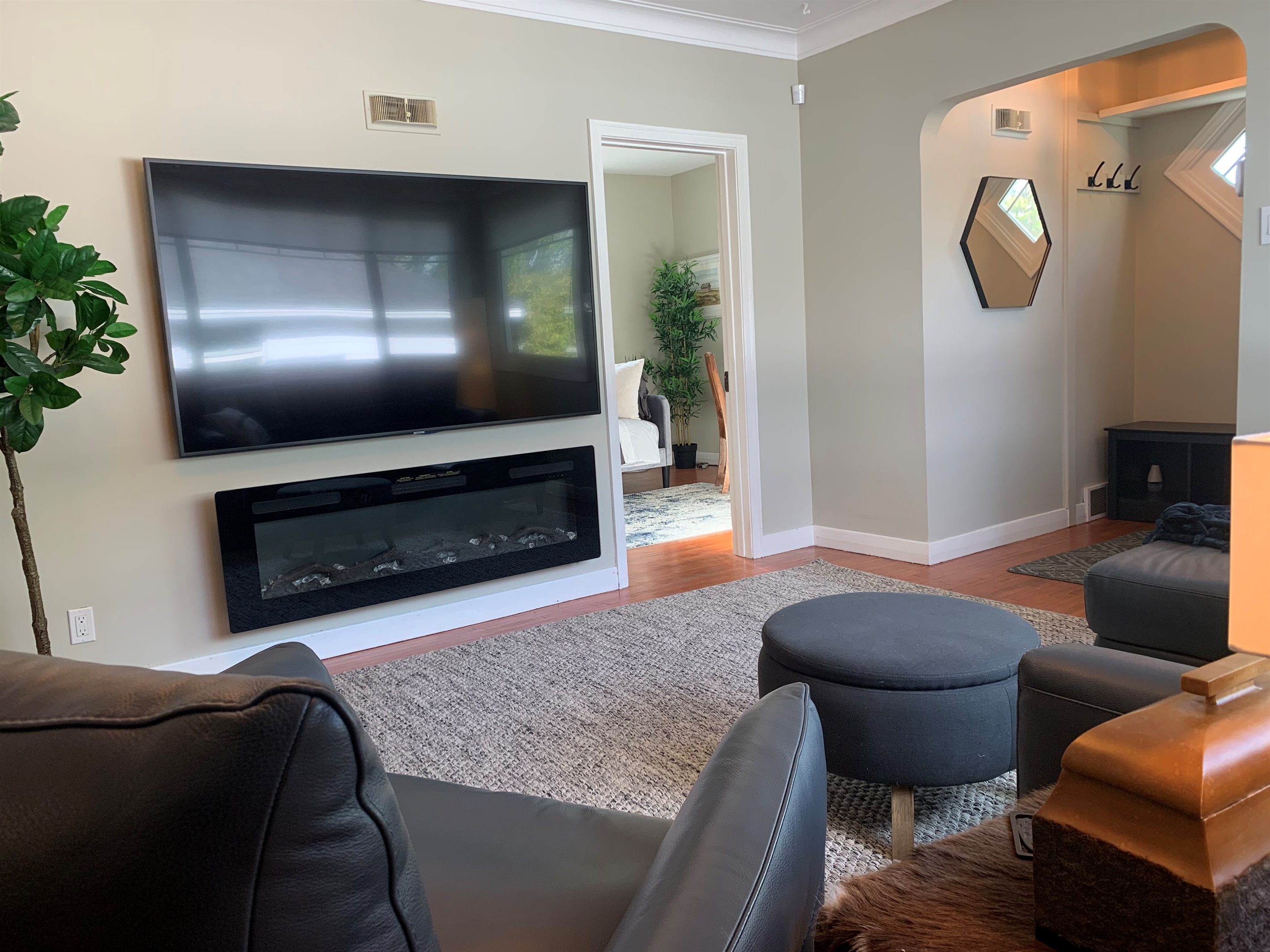 Bright Main Living Room with 75″ Smart TV & Cozy Fireplace