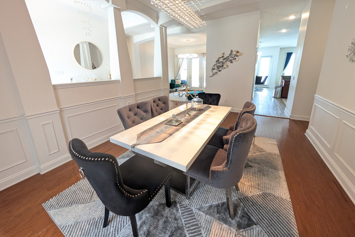 Enjoy meals together in the home's dedicated dining room, surrounded by bright and polished finishes.