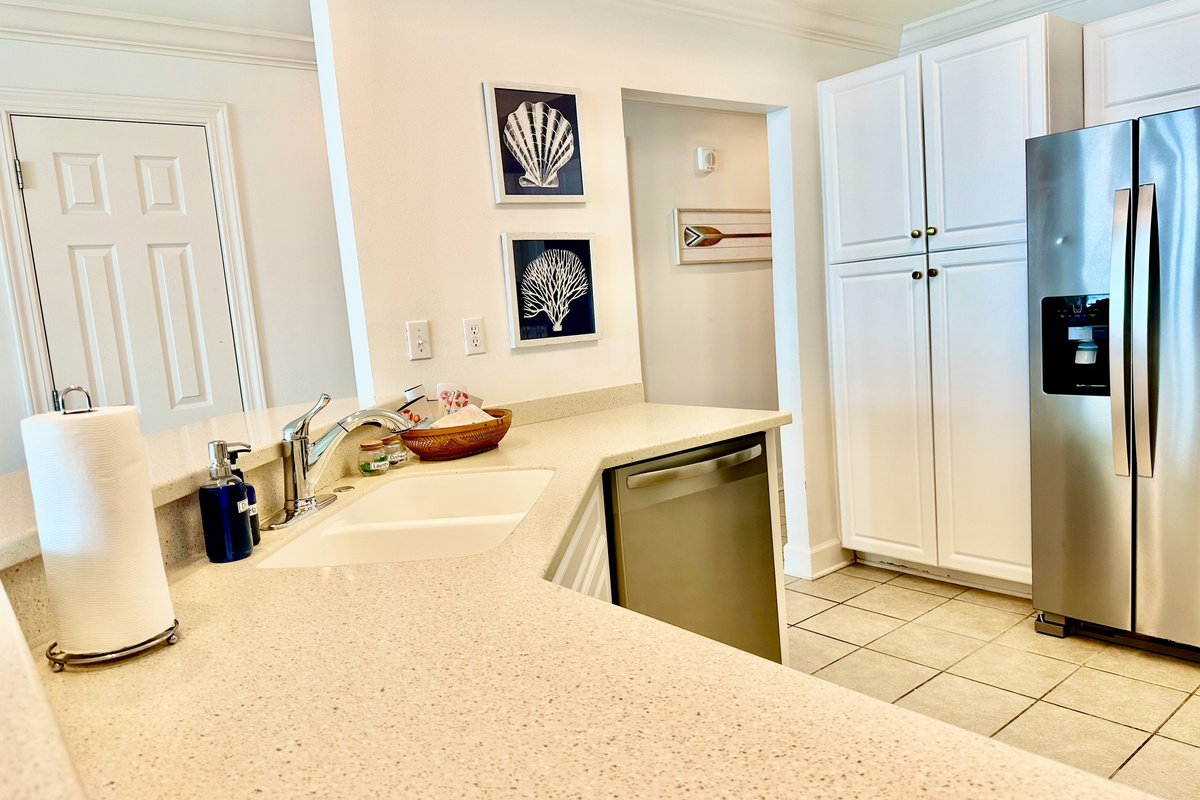 There's a very large pantry to the left of the fridge.