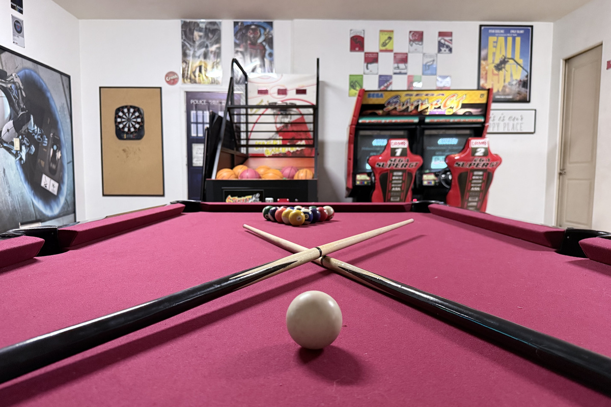 Epic games room features billiards, basketball, dual arcade racing, ping pong, darts…