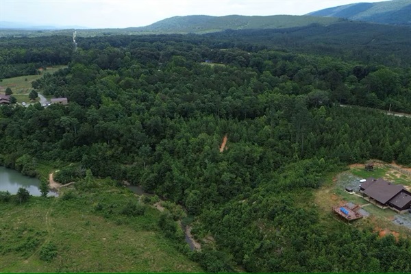 Aerial view emphasizing the cabin’s total seclusion and private river frontage.