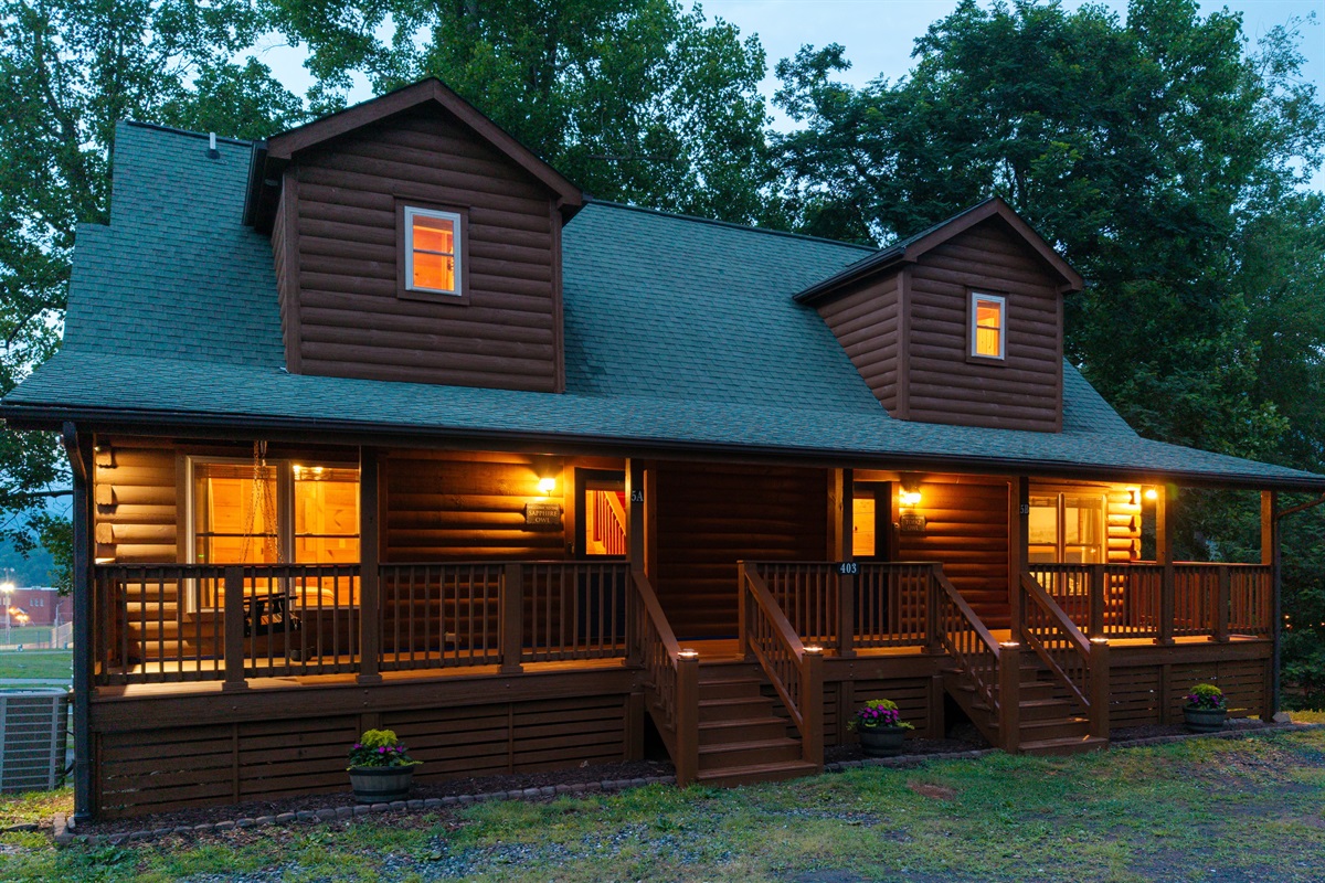 The cabin glows at dusk, welcoming you back after a day of exploration. Pure mountain magic!