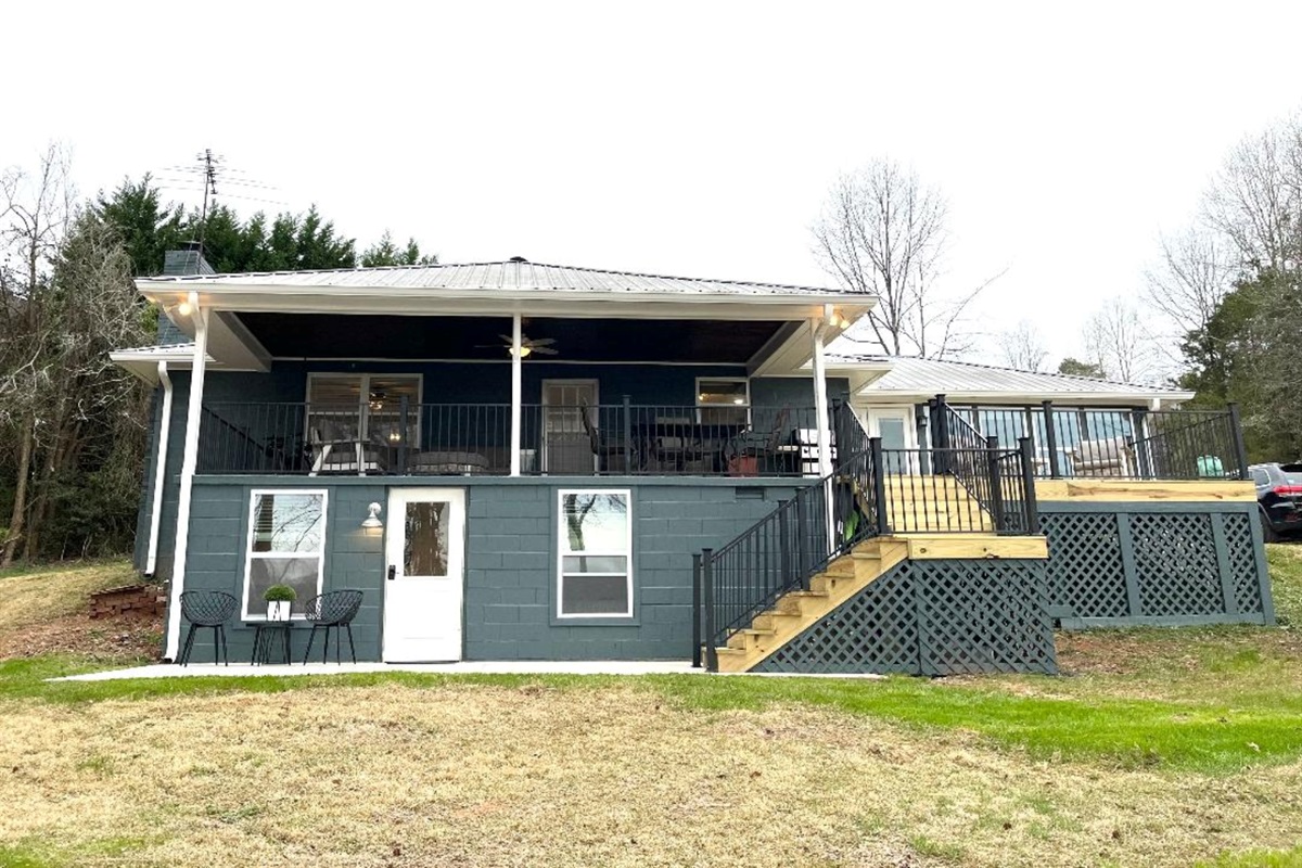 Back view of the house - must walk outside to get to the downstairs entry